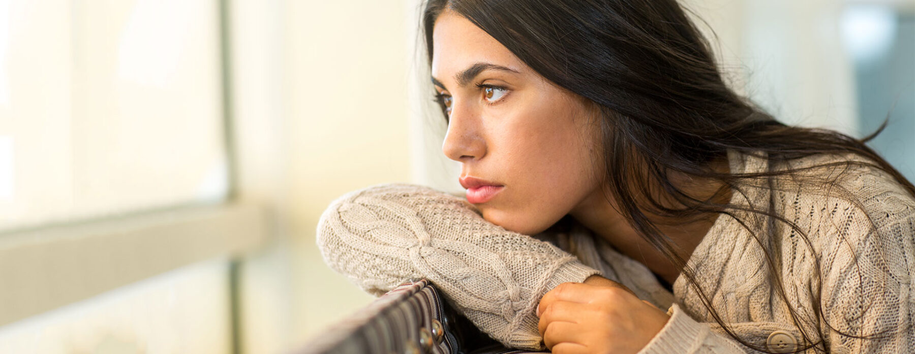 Woman thinking about taking a pregnancy test